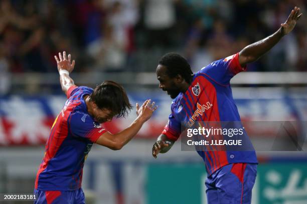 Peter Utaka of FC Tokyo celebrates with teammate Sei Muroya after scoring the team's first goal during the J.League J1 match between FC Tokyo and...