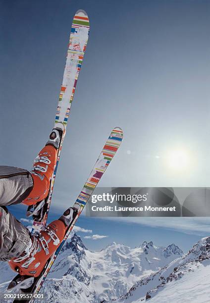 skiier on slope, skis in air, low section - st moritz stock pictures, royalty-free photos & images