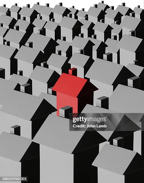 red house amongst multiple grey houses (digital composite) - hausmodell stock-grafiken, -clipart, -cartoons und -symbole