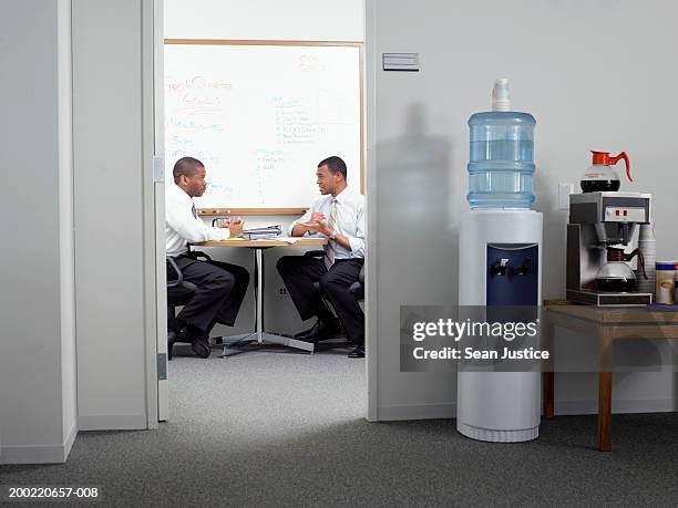 businessmen talking in office - office doorway stock pictures, royalty-free photos & images