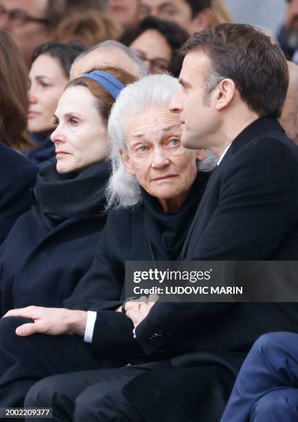 French President Emmanuel Macron and the widow of the late former French justice minister Robert Badinter, Elisabeth Badinter attend a national...