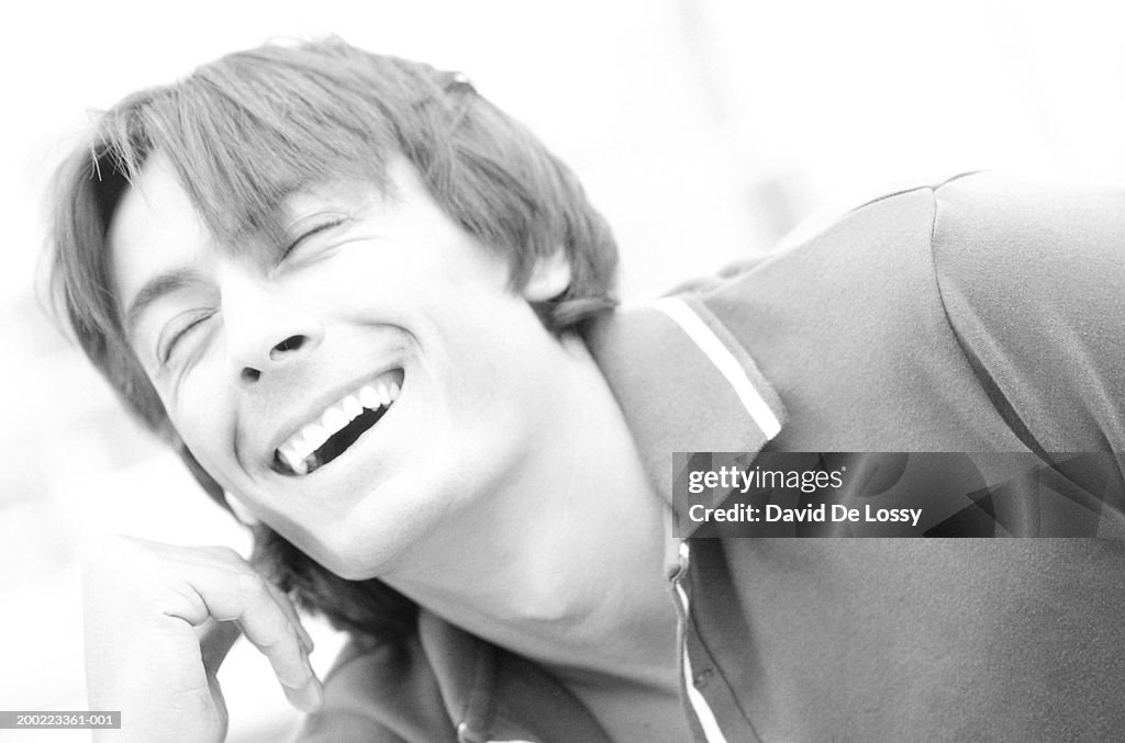 Young man smiling, close-up