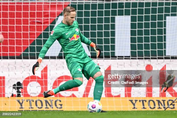 Goalkeeper Peter Gulacsi of RB Leipzig controls the Ball during the Bundesliga match between FC Augsburg and RB Leipzig at WWK-Arena on February 10,...
