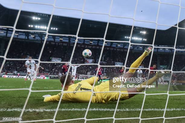 Lois Openda of RB Leipzig and Goalkeeper Finn Dahmen of FC Augsburg in a duel, in a penalty during the Bundesliga match between FC Augsburg and RB...