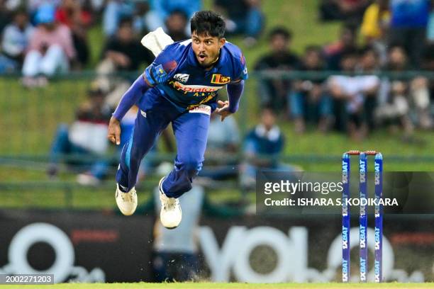 Sri Lanka's Pramod Madushan delivers a ball during the third and final one-day international cricket match between Sri Lanka and Afghanistan at the...