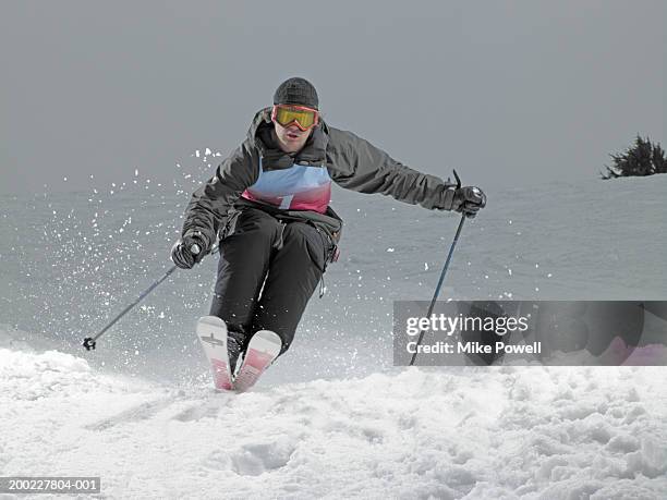 skier, skiing down slope - pantaloni da sci foto e immagini stock