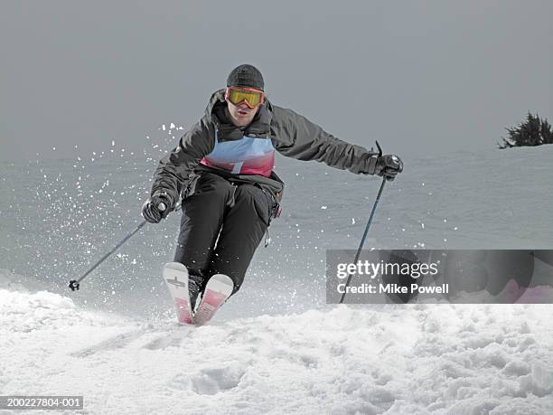 skier, skiing down slope - calças para esquiar imagens e fotografias de stock