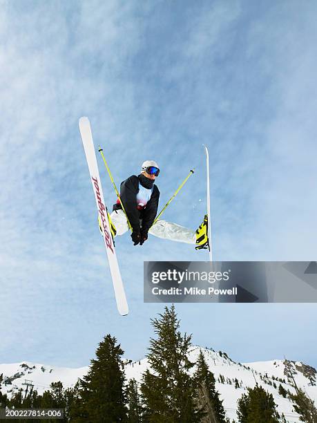 skier doing freestyle jump in air - mammoth stock-fotos und bilder