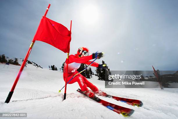 female skier in giant slalom ski race (blurred motion) - slalom stockfoto's en -beelden