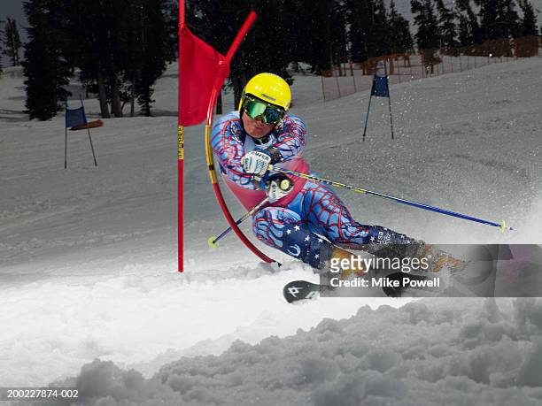 skier in slalom ski race (blurred motion) - slalom skiing fotografías e imágenes de stock