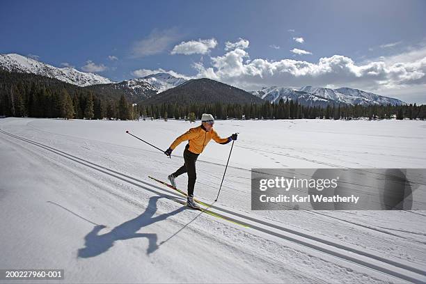 usa, sun valley, idaho, mature man cross-country skiing - 北歐滑雪項目 個照片及圖片檔