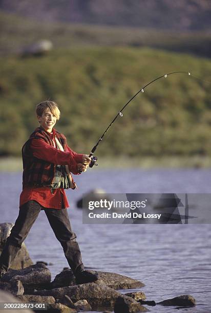 Teenage Boy Fishing In River Smiling High-Res Stock Photo - Getty Images