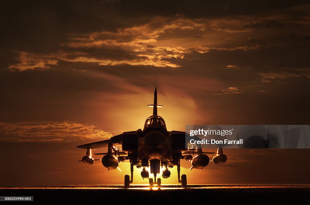 Tornado war plane, silhouette, sunset