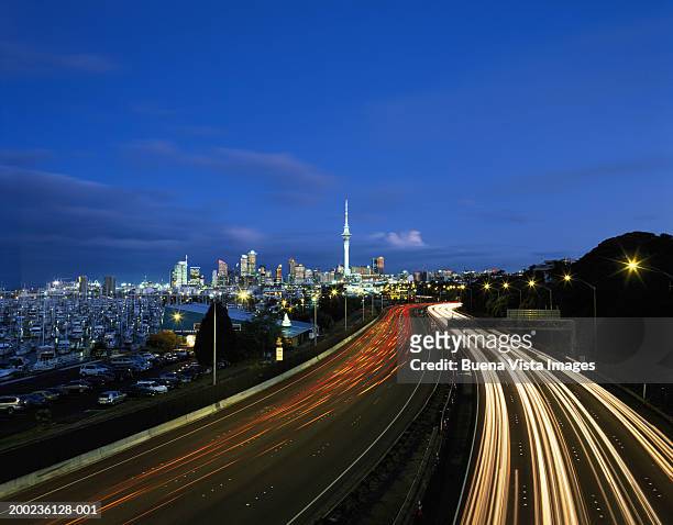 new zealand, north island, auckland skyline, dusk (long exposure) - auckland motorway stock pictures, royalty-free photos & images