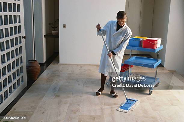 woman mopping hotel lobby - daily bucket fotografías e imágenes de stock