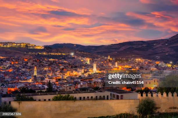 sunset over fez medina with historic architecture. - ceramics fez stock-fotos und bilder