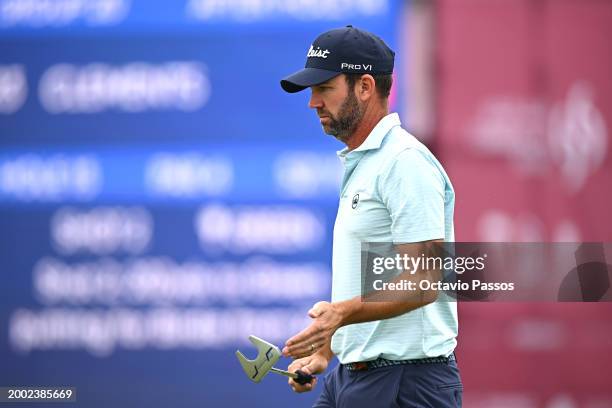 Scott Jamieson of Scotland lines up a putt on the 15th green during day four of the Commercial Bank Qatar Masters at Doha Golf Club on February 11,...