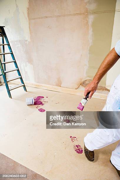 man walking spilt paint across floor, low section - clumsy walker stock pictures, royalty-free photos & images