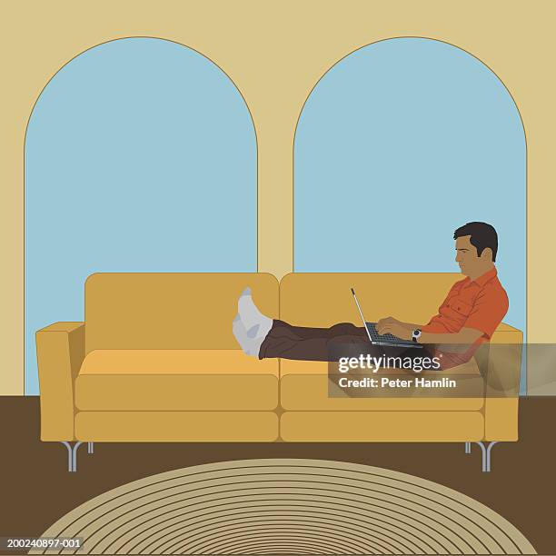 man lying on sofa, working on laptop computer, side view - man sofa stock illustrations