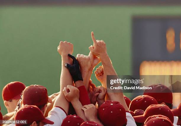 baseball players celebrating, holding arms in air, high section - baseball team stock pictures, royalty-free photos & images