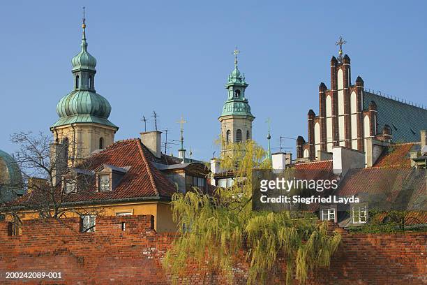 poland, warsaw, st martin's church and arch cathedral basilica - warsaw spire stock pictures, royalty-free photos & images