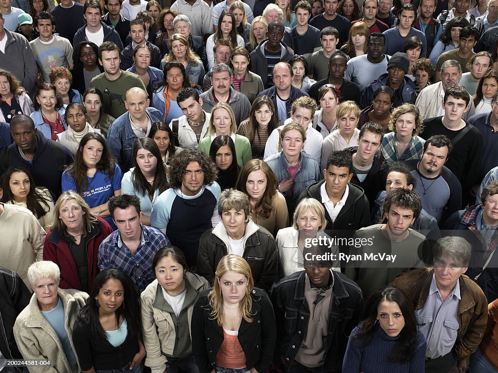 Large crowd of people looking up, portrait, elevated view