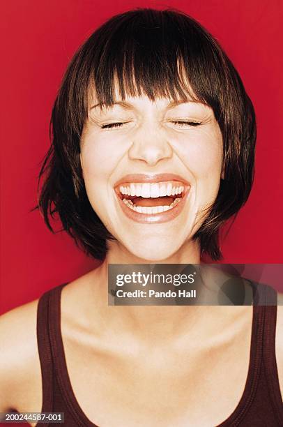 young woman laughing, eyes closed, close-up - woman vest stock pictures, royalty-free photos & images