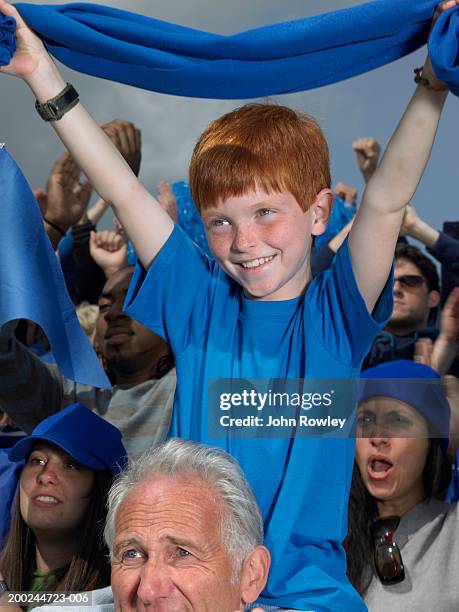 stadium crowd cheering, boy (7-9) sitting grandfather's shoulders - fan scarf bildbanksfoton och bilder