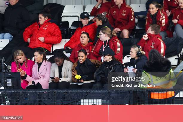 Alex Scott and Jess Glynne look on from the stands prior to the Adobe Women's FA Cup Fifth Round match between Arsenal and Manchester City at Meadow...