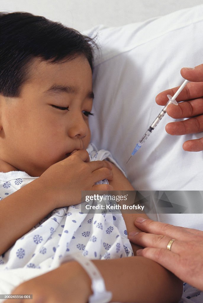 Boy Getting Injection In Arm High-Res Stock Photo - Getty Images