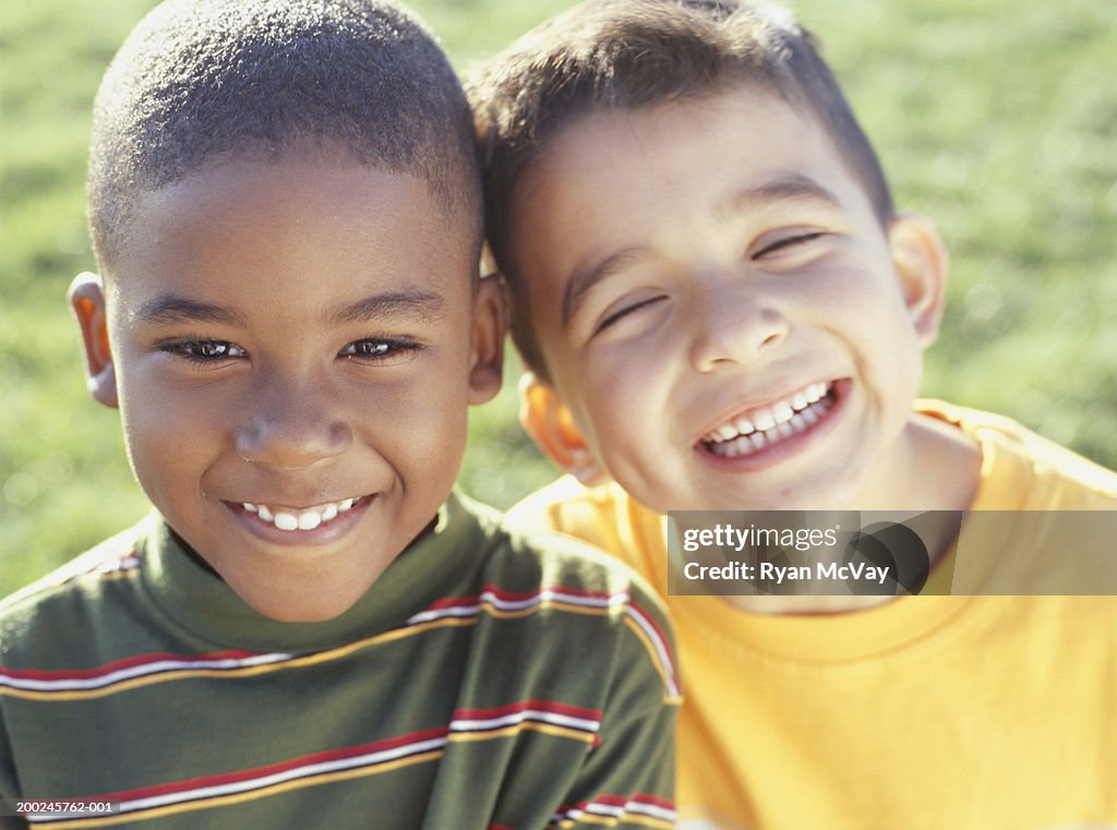 Two boys (4-5) head to head, (Portrait)