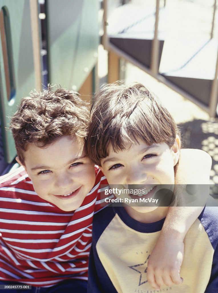 Two boys (4-5) in playground, (Portrait)