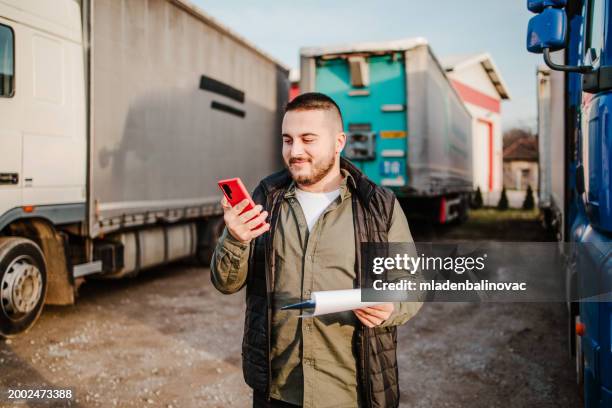 professional truck driver in front on his truck - transportation truck stock pictures, royalty-free photos & images