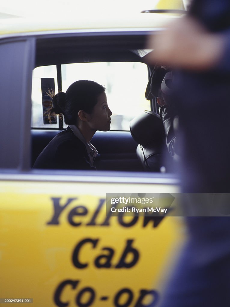 Businesswoman in taxi