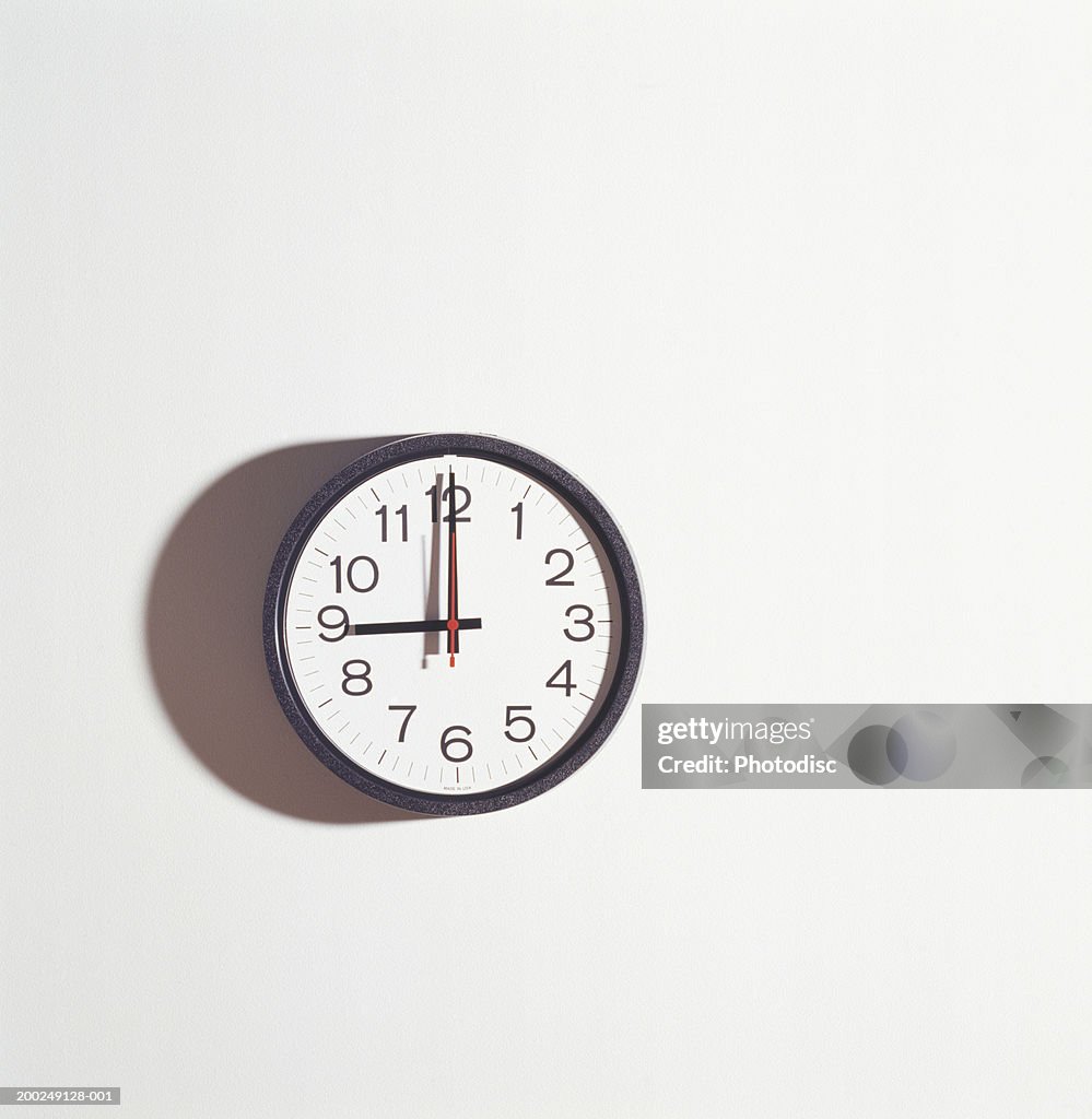 Wall clock on white wall