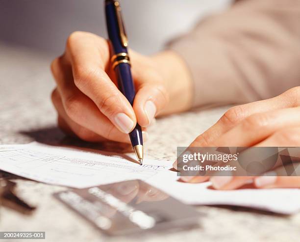Cheque Signing Form 185 Person Signing A Cheque Stock Photos, High-Res Pictures, and Images ...
