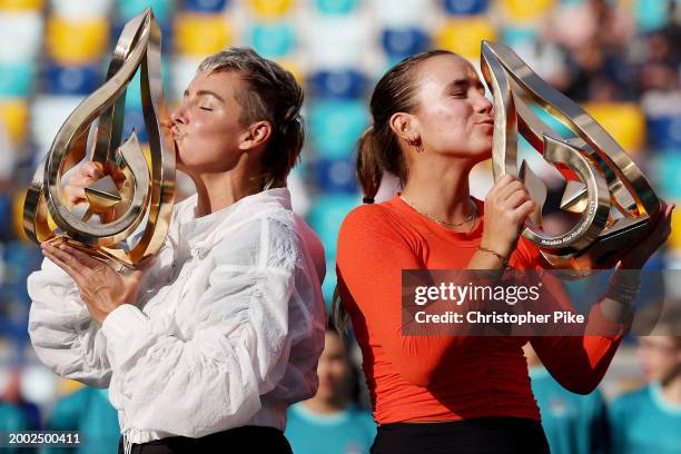 Sofia Kenin of the United States and Bethanie Mattek-Sands of the United States pose with trophies after defeating Linda Noskova of Czech Republic...