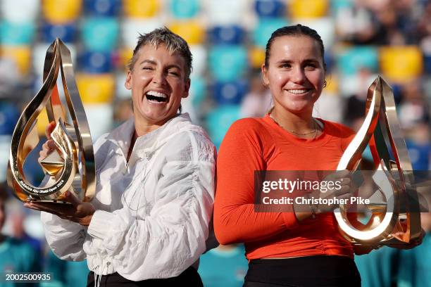 Sofia Kenin of the United States and Bethanie Mattek-Sands of the United States pose with trophies after defeating Linda Noskova of Czech Republic...