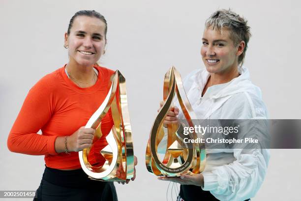 Sofia Kenin of the United States and Bethanie Mattek-Sands of the United States pose with trophies after defeating Linda Noskova of Czech Republic...