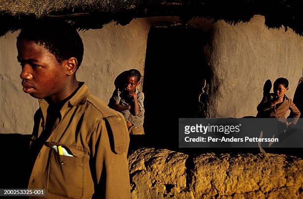 farm worker and younger brothers stand outside their house in wakkerstrom, south africa - apartheid stock pictures, royalty-free photos & images