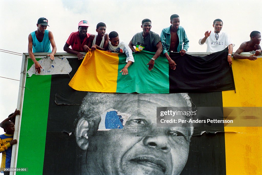 ANC supporters cheer President Nelson Mandela as his motorcade passes by during election campaign in Durban, South Africa