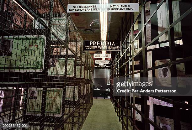 Identity cards are displayed at the entrance to the Apartheid museum on December 19, 2001 in Johannesburg, South Africa. Every visitor is classified...