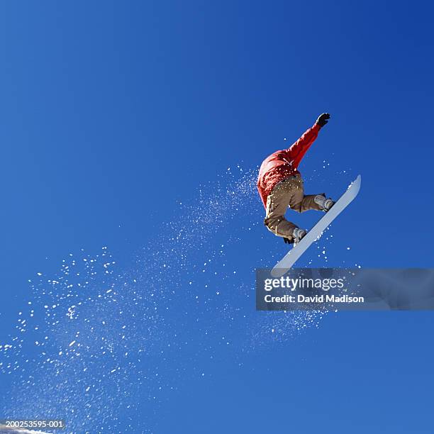 snowboarder in air, low angle view - snowboard jump bildbanksfoton och bilder