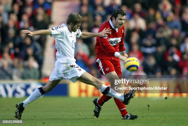 Olof Mellberg of Aston Villa and Mark Viduka of Middlesbrough challenge during the Premier League match between Middlesbrough and Aston Villa at...