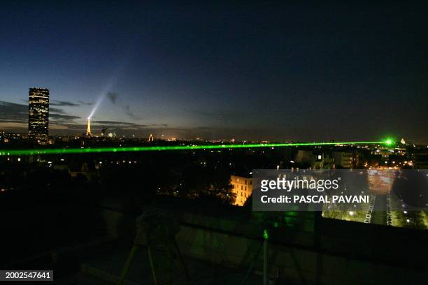 Laser sweeps the City of Light from the Observatory of Paris 29 September 2005, in a teaser for the coming "Nuit Blanche" which aims to entertain the...