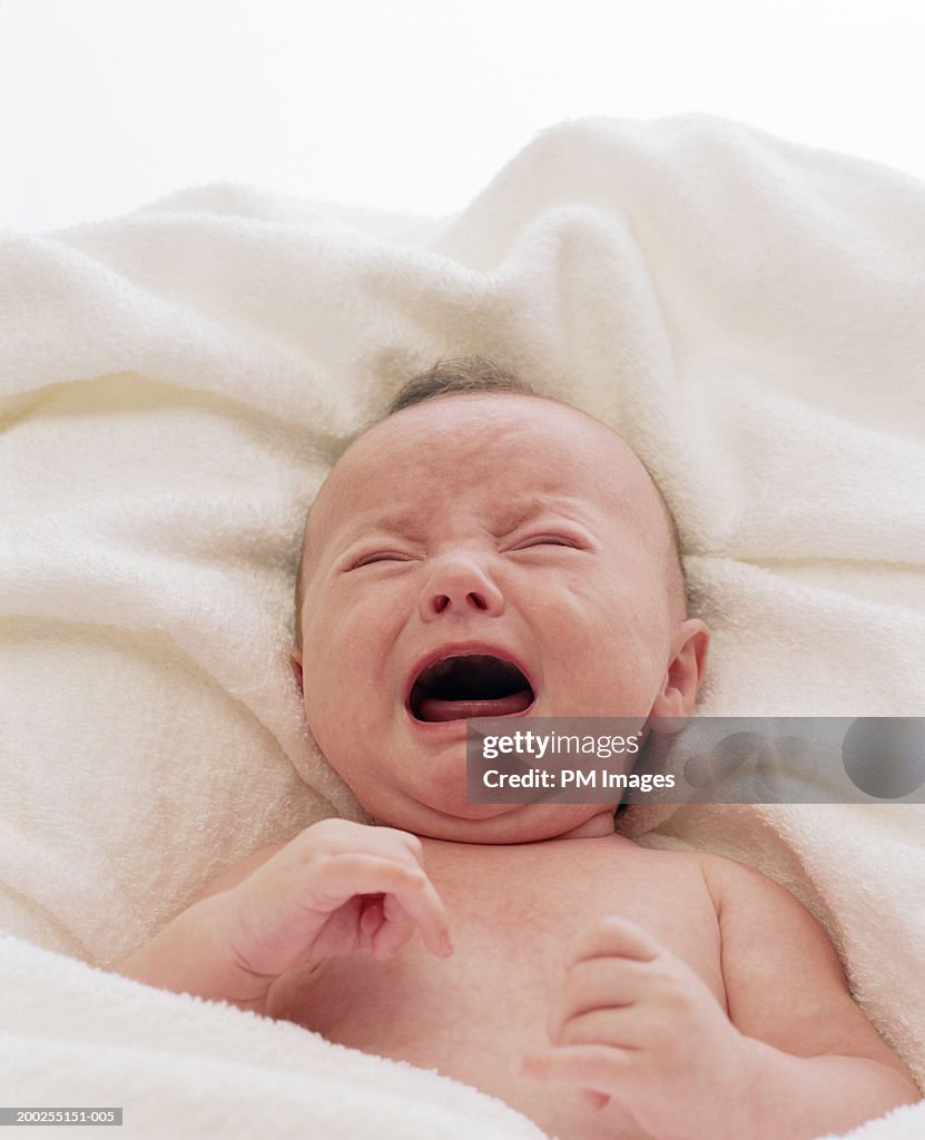 Baby boy (0-3 months) criying, overhead view