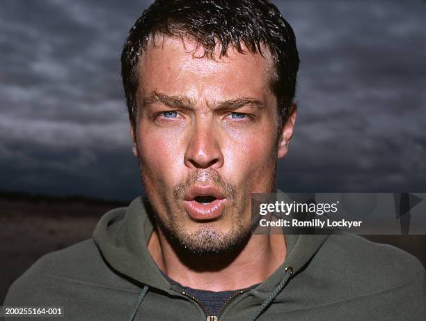 man outdoors, sweating and breathing heavily, portrait, close-up - man sweating bildbanksfoton och bilder