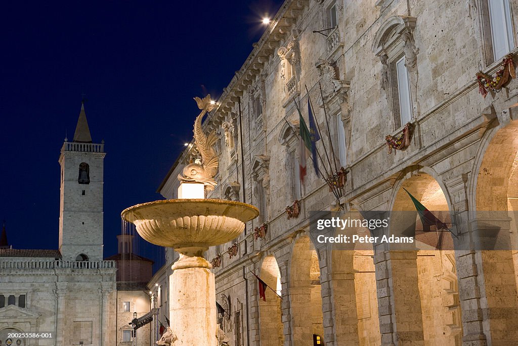 Italy, Marche, Ascoli Piceno, fountain in square, night