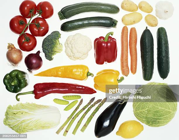 vegetables on illuminated white surface, overhead view - gelbe paprika stock-fotos und bilder