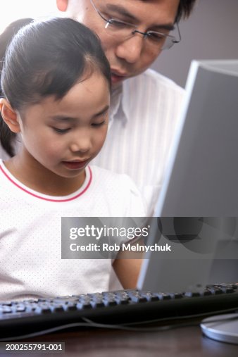 Father And Daughter Using Computer High-Res Stock Photo - Getty Images